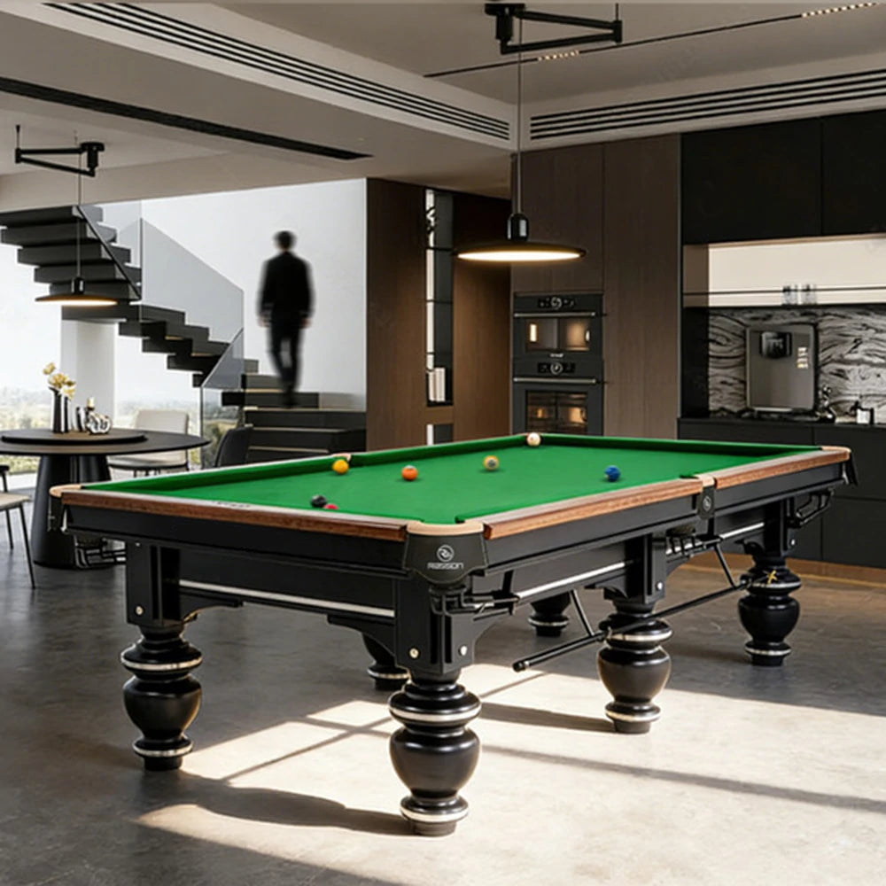 Billiard table in a modern living room with staircase and kitchen in the background