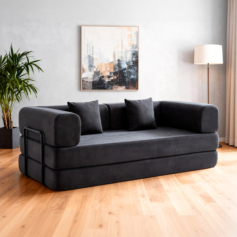 Folding corduroy sofa bed with pillows